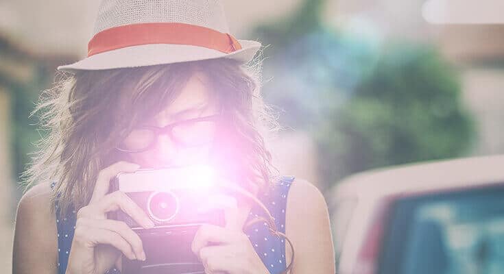 Flash Photography with woman using a retro camera