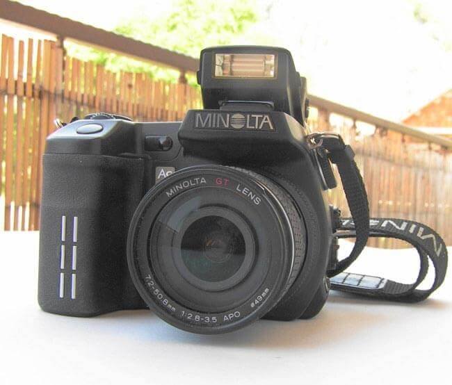 MINOLTA DIGITAL CAMERA with a pop-up Flash by Brian Eager