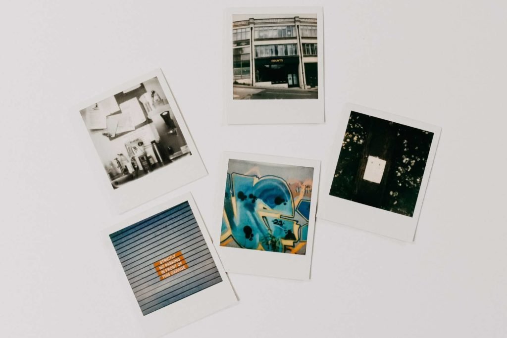 flat lay shot of polaroid frames that feature outdoor scenes.