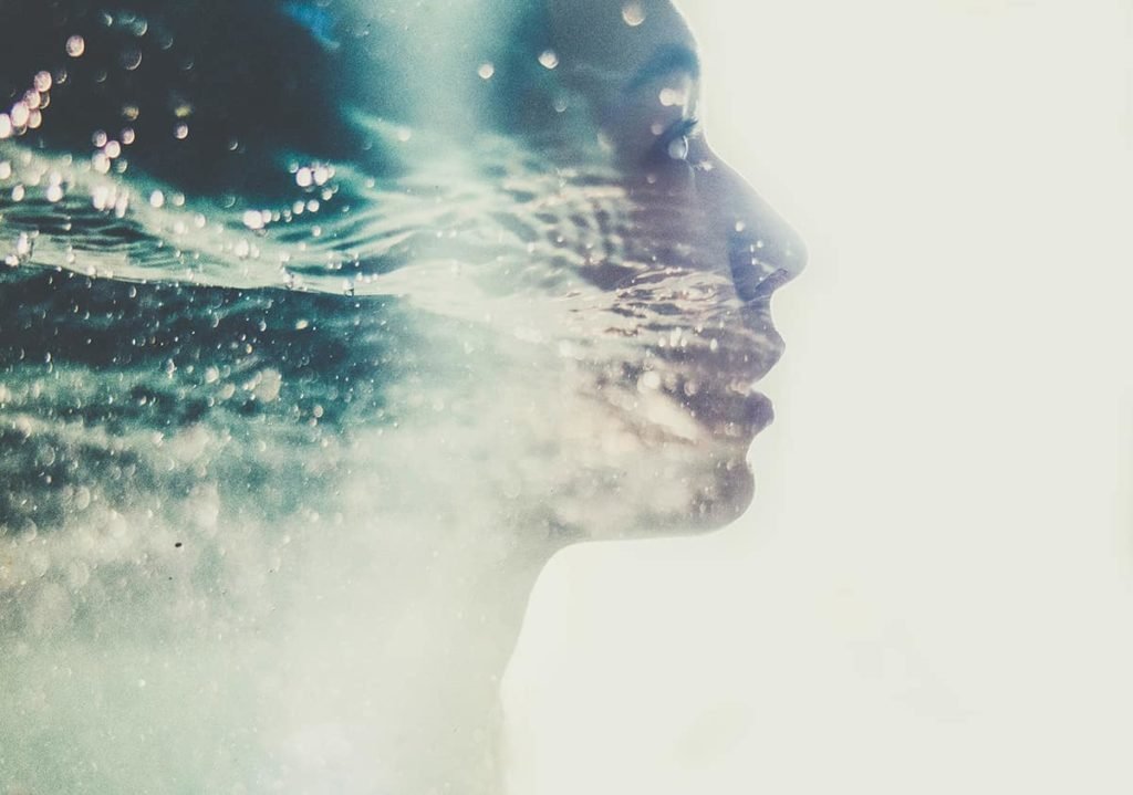 double exposure self-portrait featuring water and a silhouette