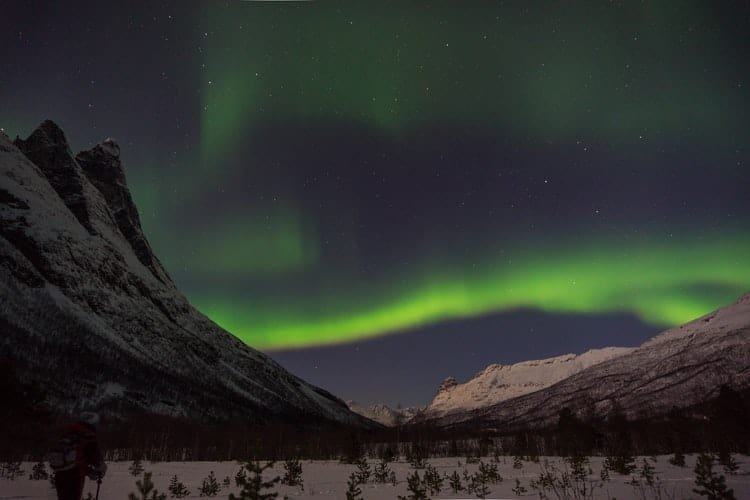 A fast wide angle lens can let you get sharply focused landscape photographs at night, such as this one of the northern lights over the Alaska landscape.