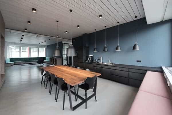 For interior photographs of darker spaces, you can use tools to bounce the light and shape it for the kinds of shadows you want, as seen in this kitchen.