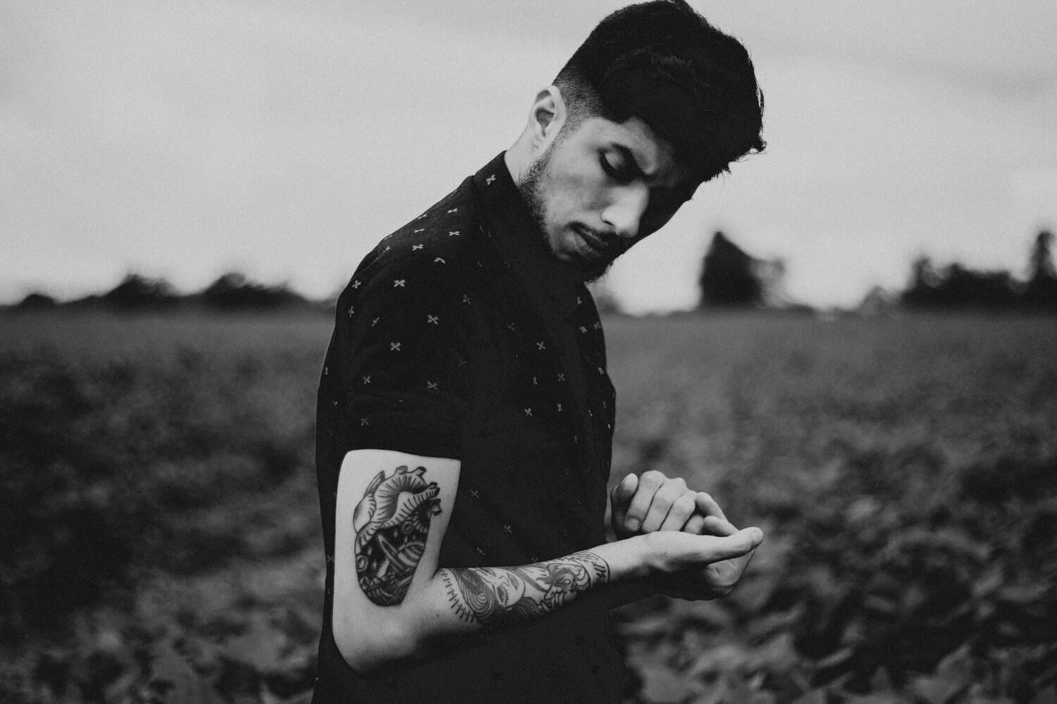 Male models often pose to show off their ink, as seen here in this image of model with tattoos.