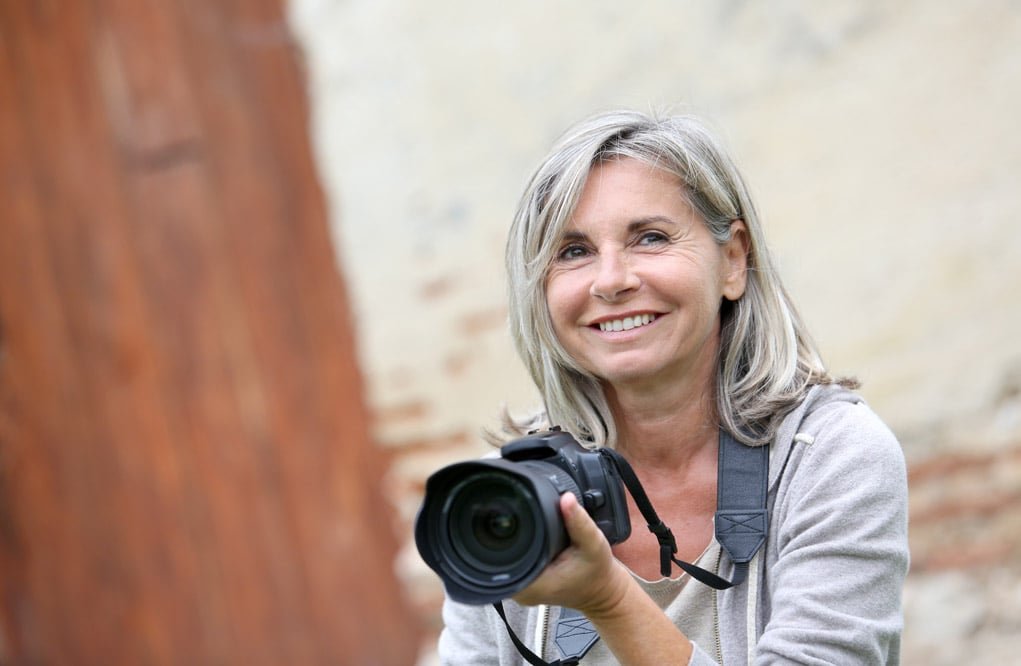 female photographer with a digital camera