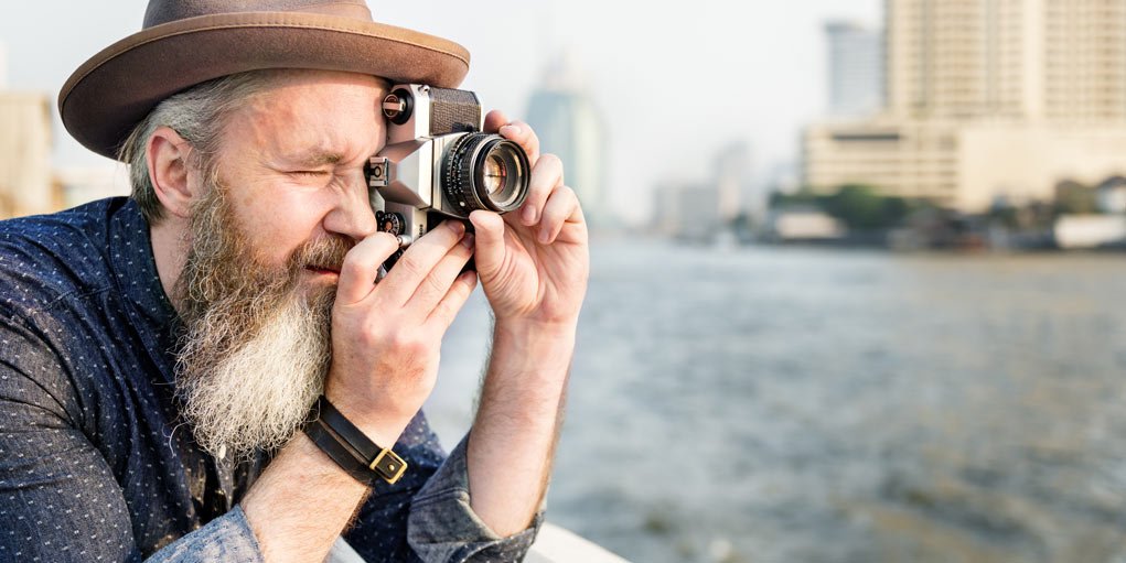 hipster with a camera understanding digital camera modes