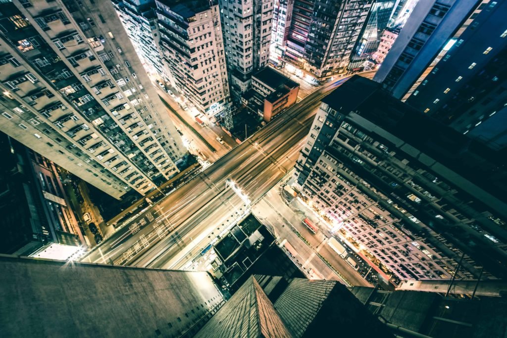 Night street photography presents unique challenges as seen in this aerial view of busy lit up city streets