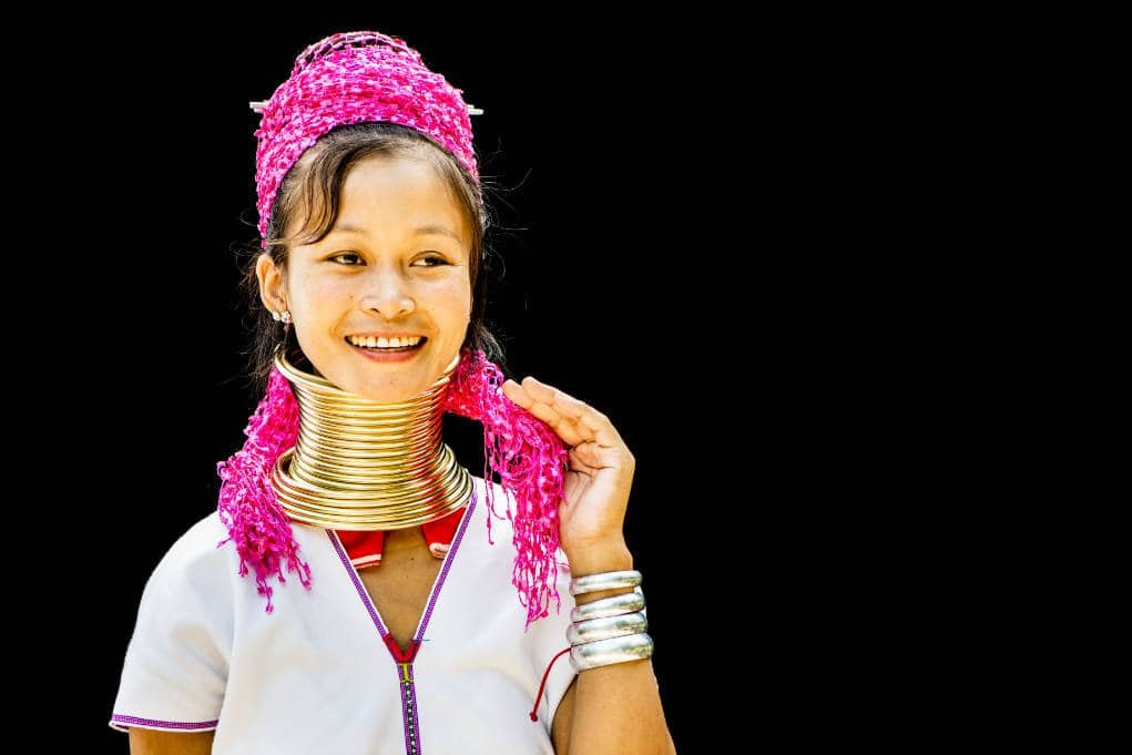 Kayan long neck woman portrait on a black background with spot metering on her face.