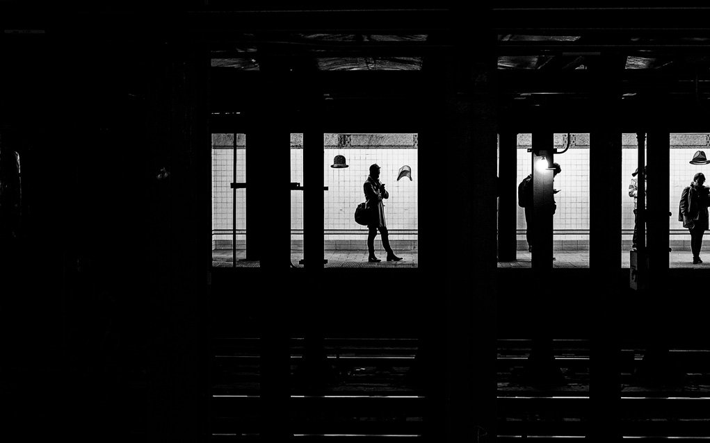 high contrast exposure of people waiting at a train platform