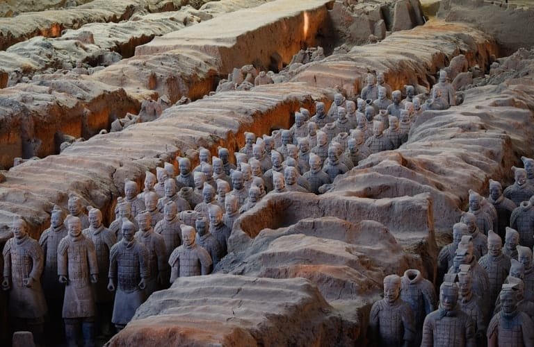 Editorial photography conveys a concept through images, as this photo of the terracotta warriors in China conveys a concept of antiquity or Chinese heritage.