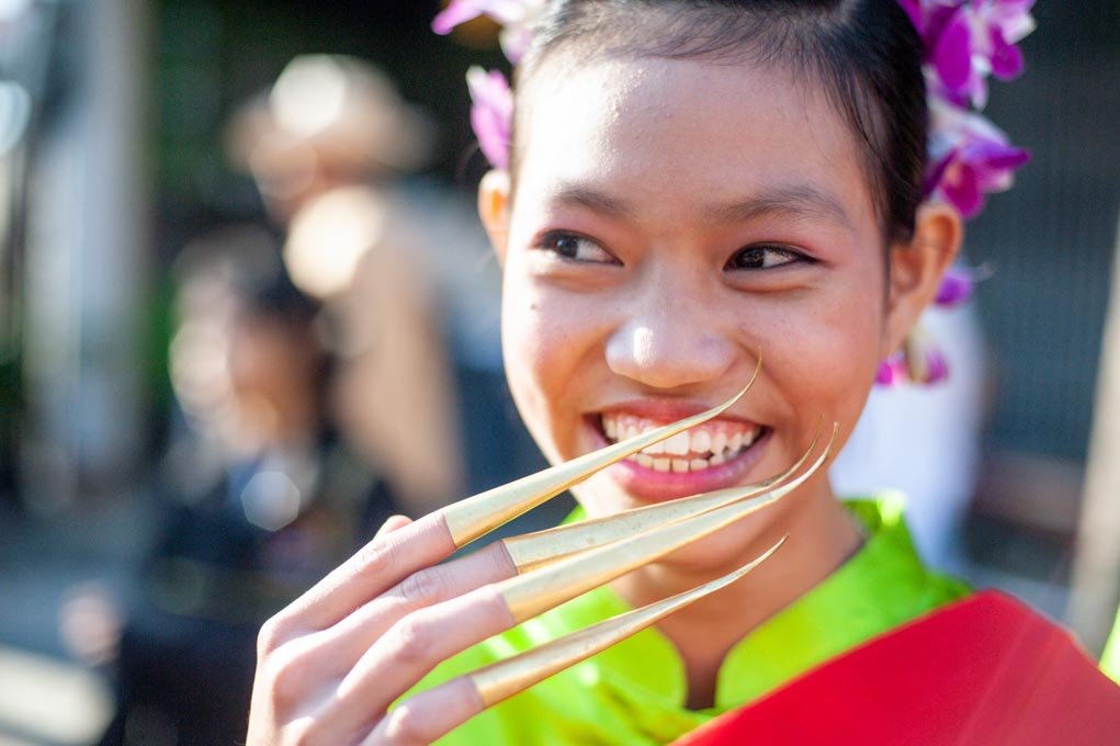 portrait of a smiling girl in a parade.