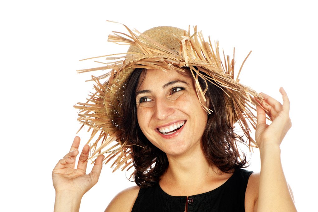 Woman wearing a straw hat.
