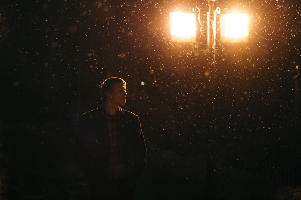 Snow portrait photography at night for a mystical feel.