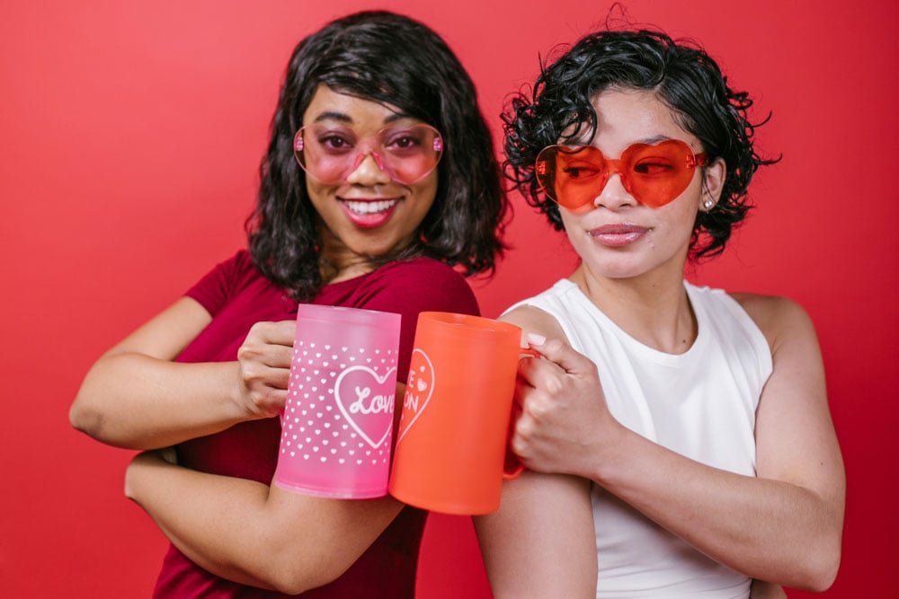 Friends doing a cute studio photography session with fun props.