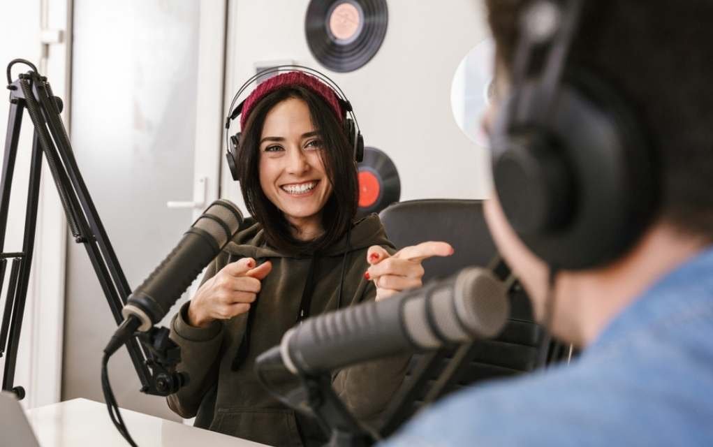 podcast host smiling.