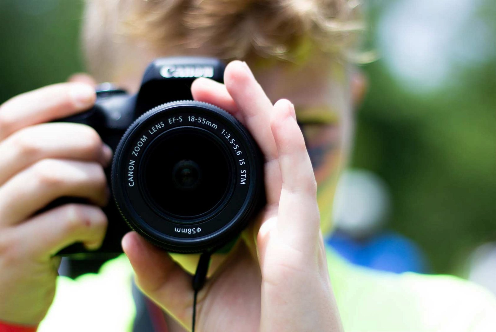 boy holding camera.