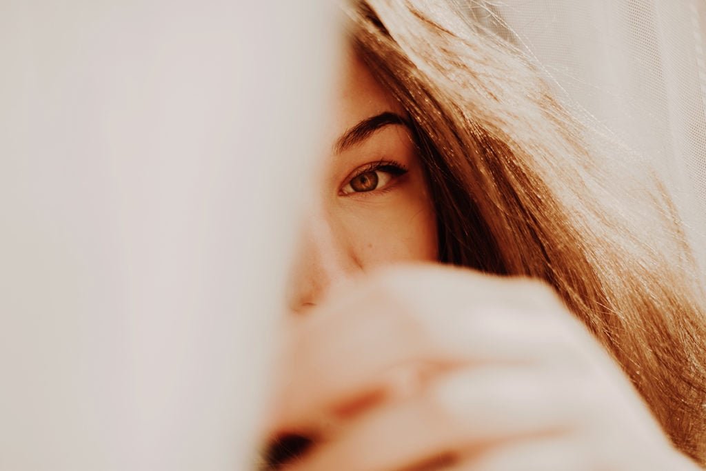 Self-portrait close-up of the model’s eye. Taken on a sunny day through a curtain.