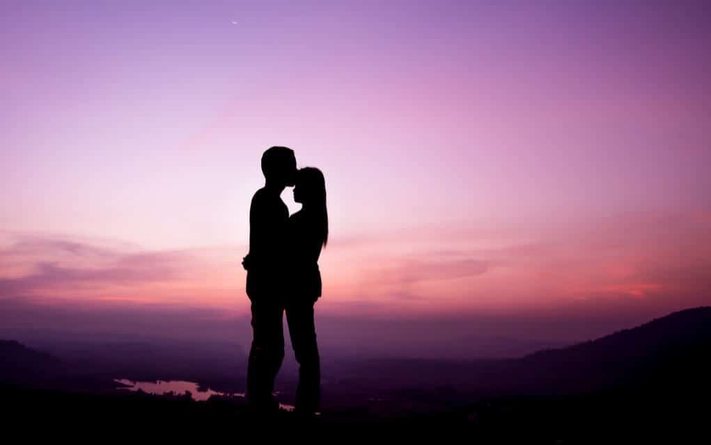 sunset silhouette photo of a couple embracing