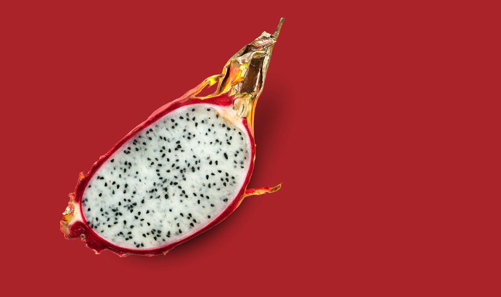dragon fruit on red background.