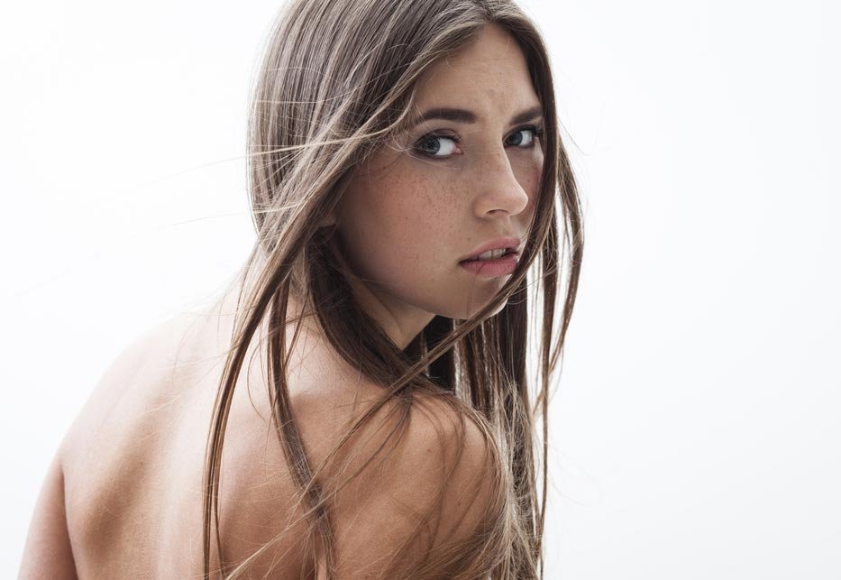over the shoulder female pose look