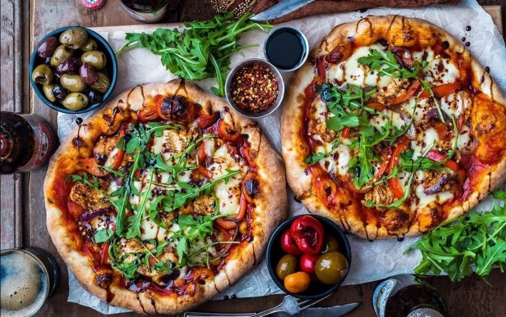 Shot of tasty looking pizzas by Dennis Prescott.
