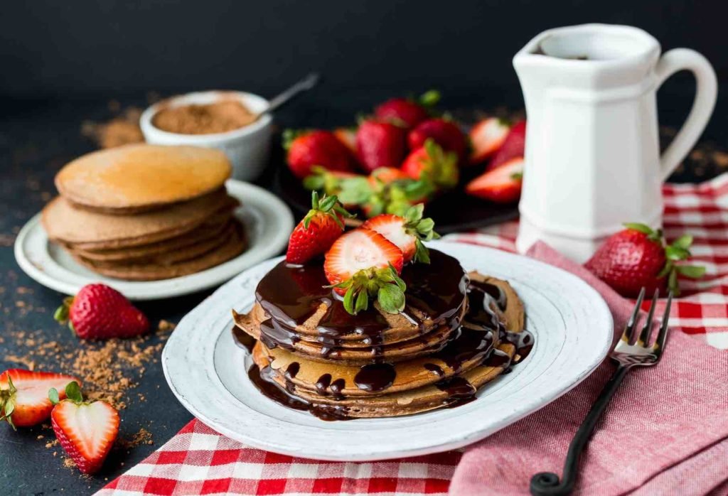 food photography styled for pancakes with strawberries.