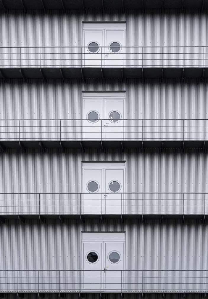 Doors in a row on a building frame.