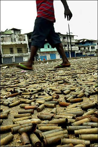 Man walking across bullets in Liberia.