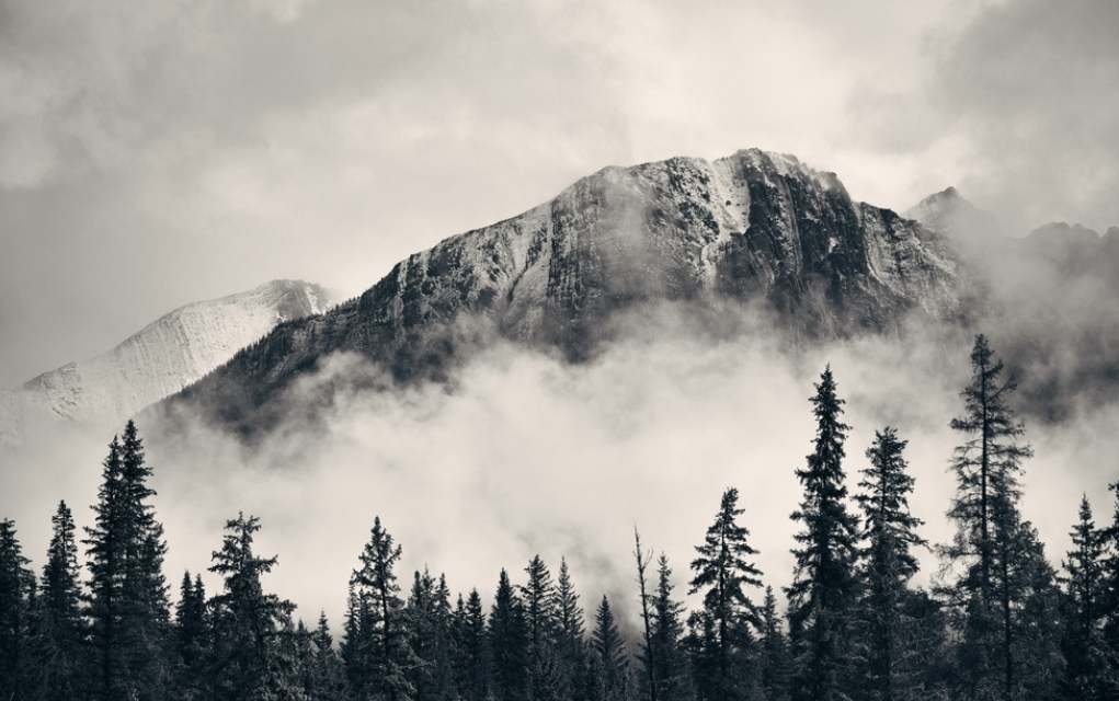 monochrome photograph of a mountain.