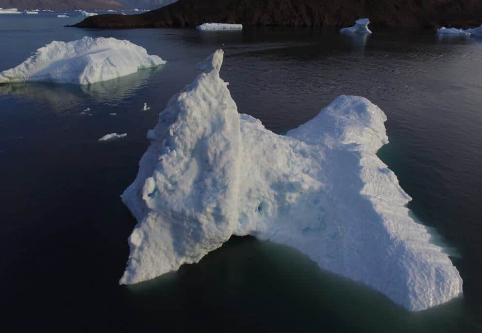 low oblique aerial photograph of a melting iceberg