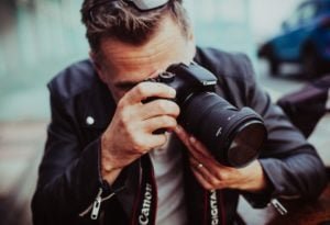 pro tips on how to hold a DSLR camera