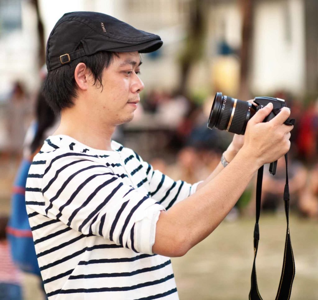 man taking a personal portrait photograph.