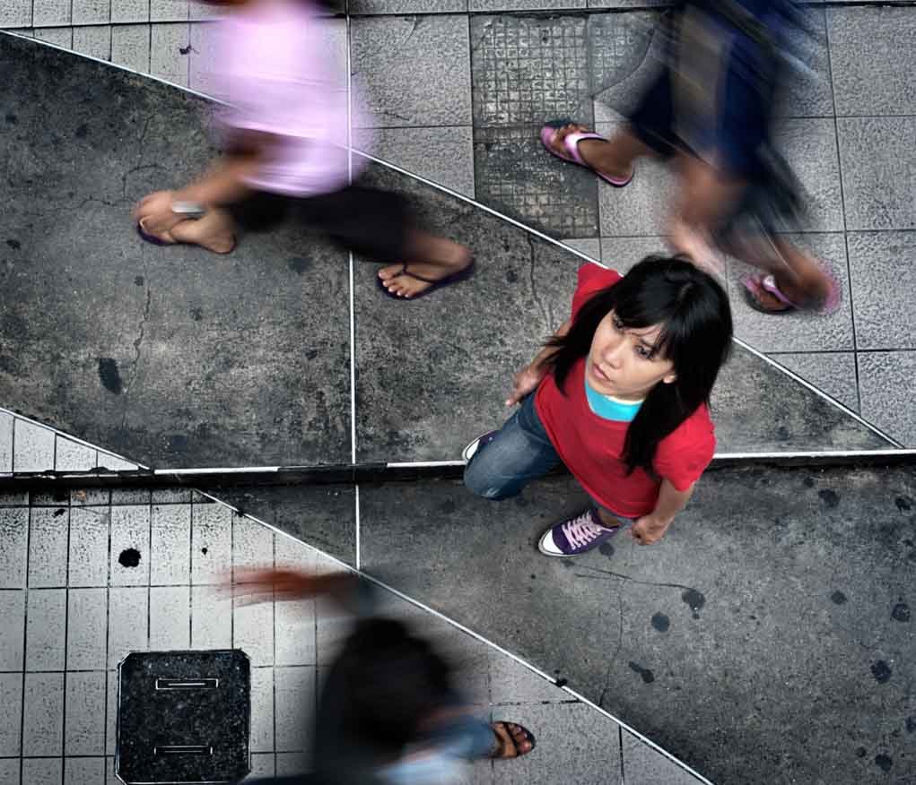 portrait of a woman in a busy street.
