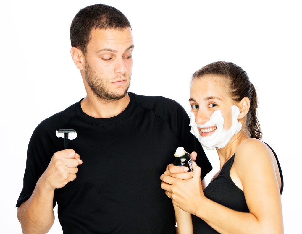 man and woman with shaver and shave cream.