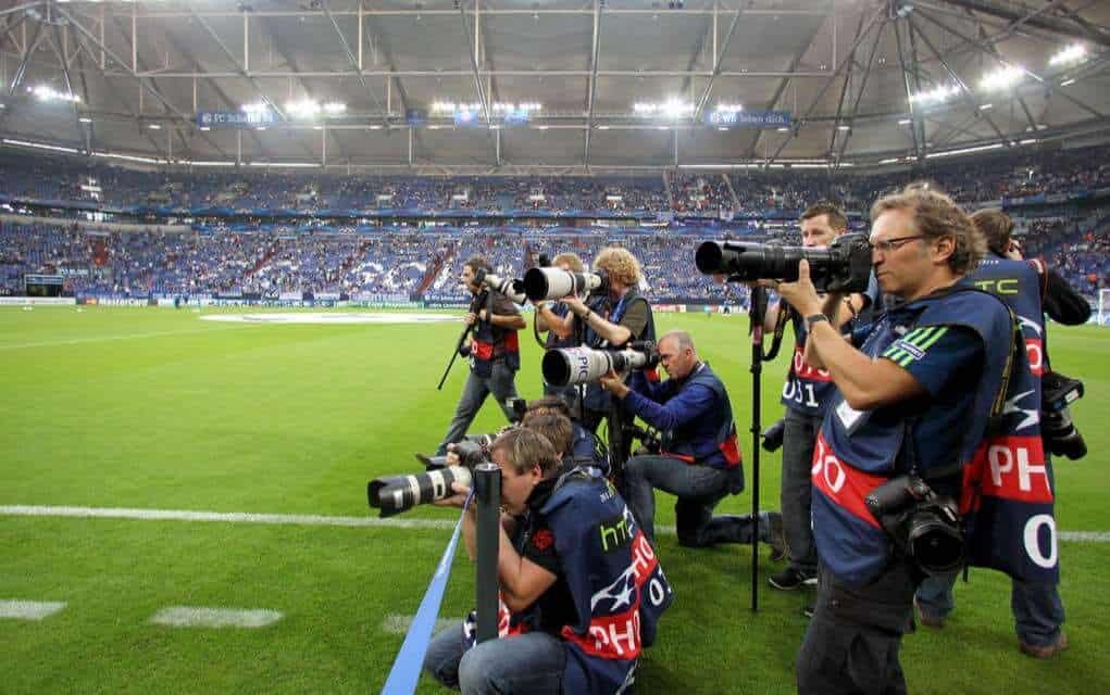 Sports photographers at the champions League match.