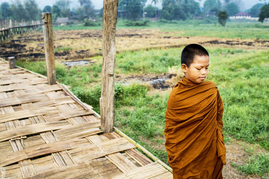 novice monk walking alone.
