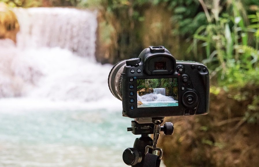 camera on a tripod in outdoor setting.