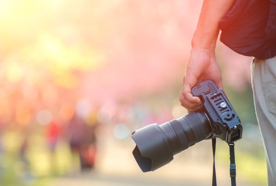 photographer holding a camera.