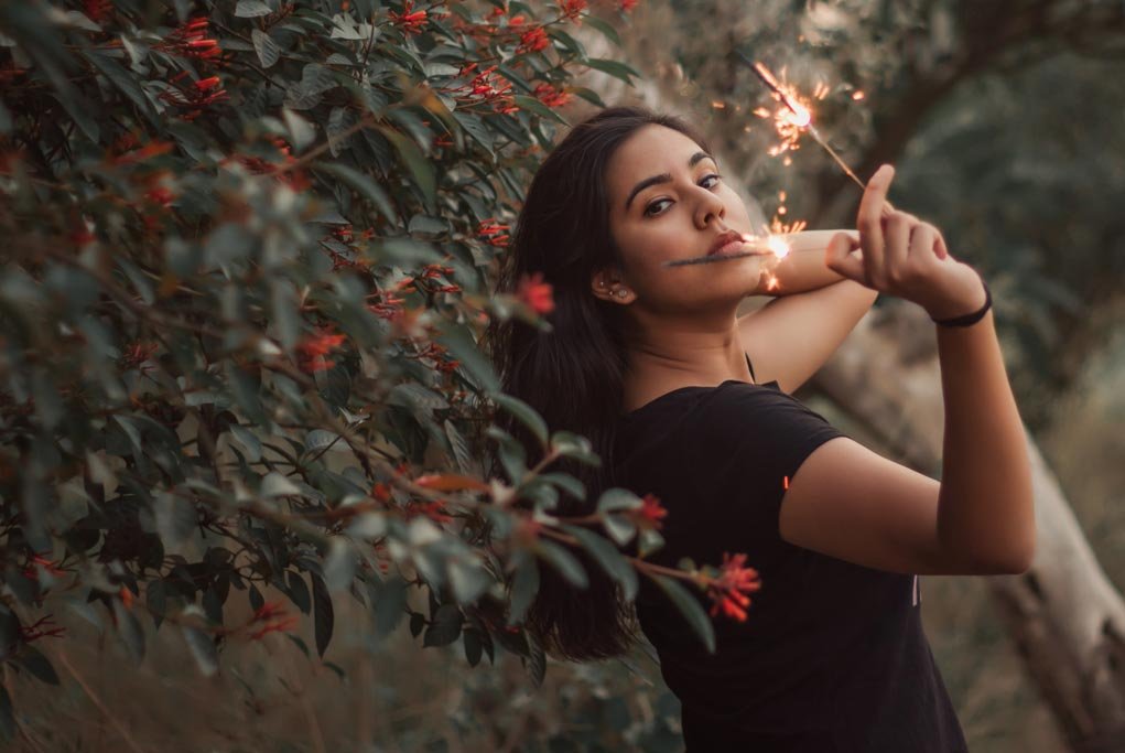 girl showing sparklers. 