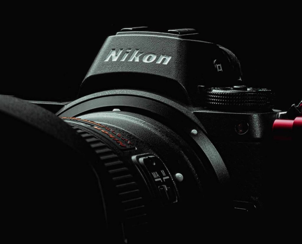 close-up of Nikon camera in artificial light.