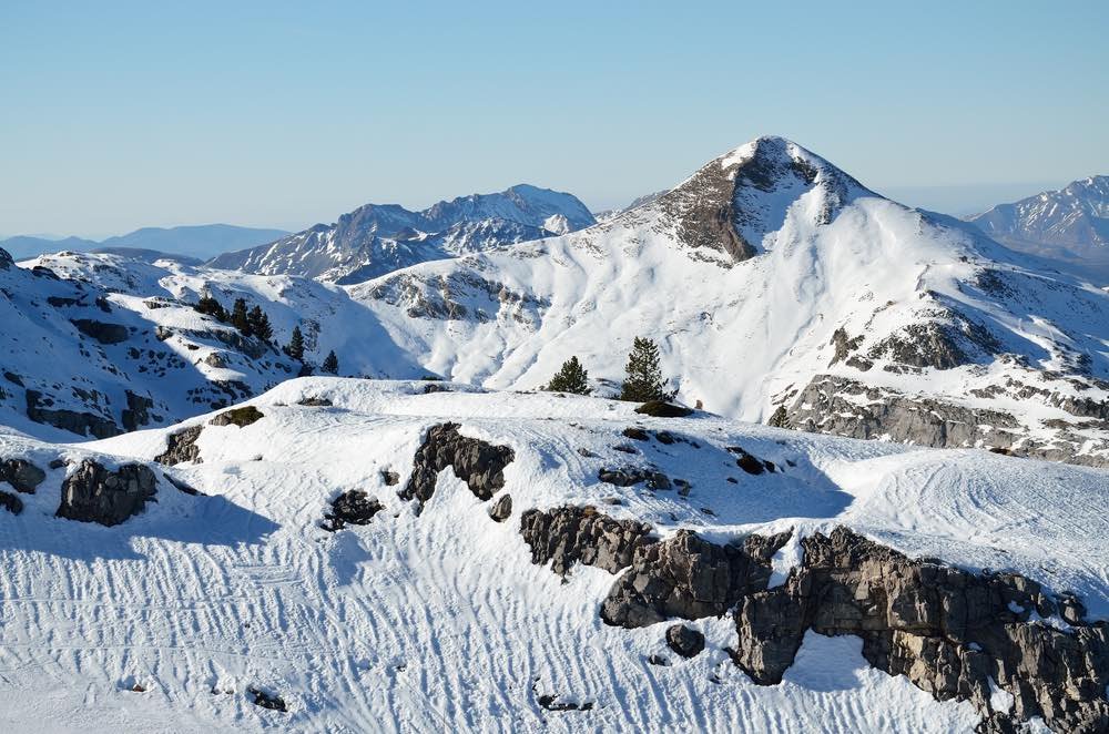 snowy mountains with a clear blue sky.