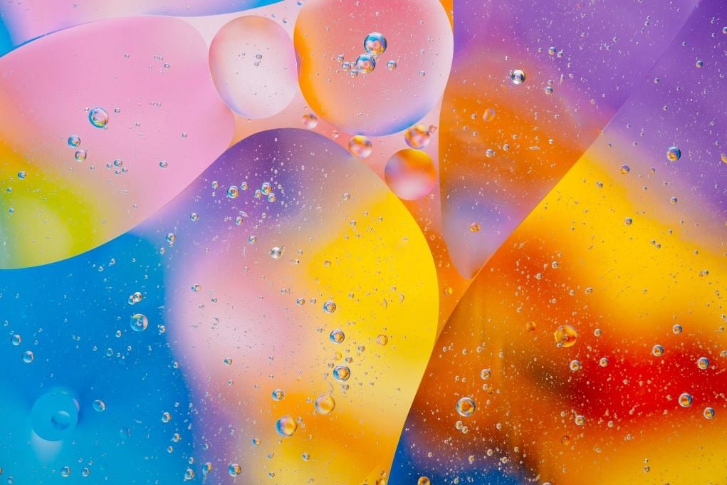 creative macro photo of colored water bubbles.