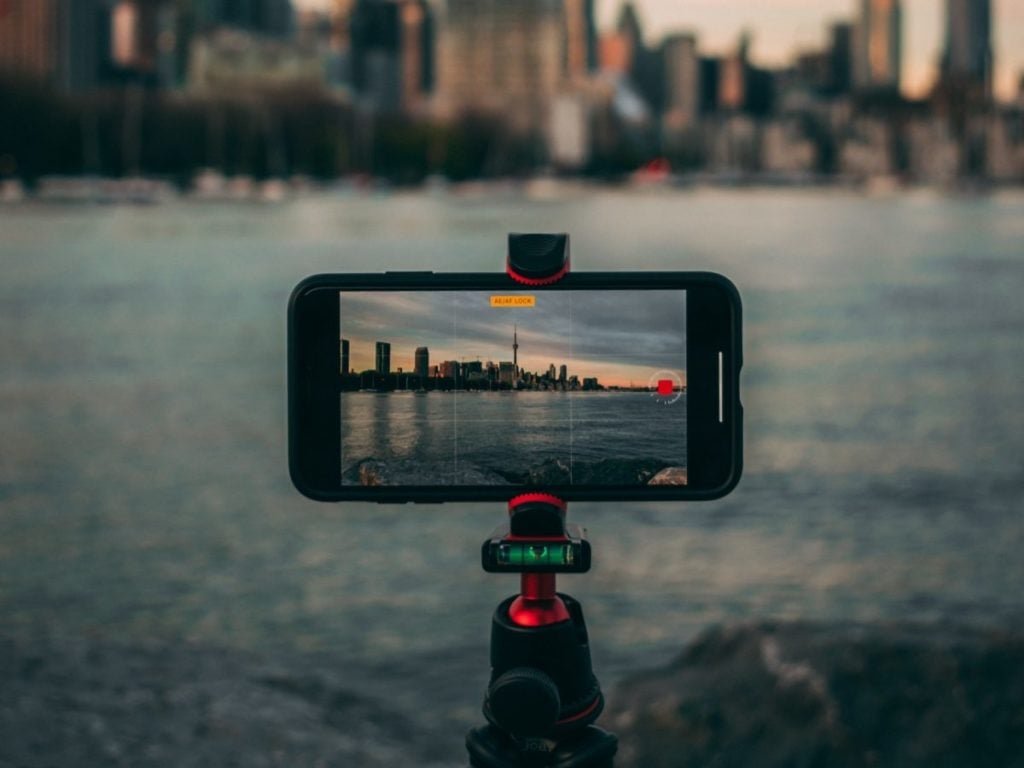 phone on tripod pointed toward Shanghai cityscape for time-lapse video.